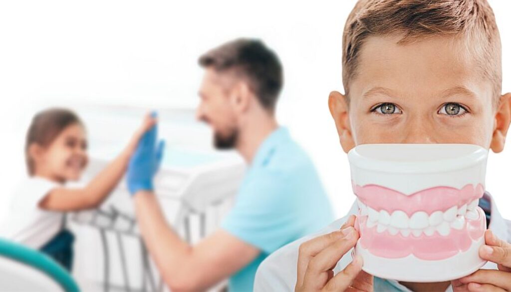 Pediatric dentistry, children teeth treatment. Boy with a large model of smile in front of the face, against the background of a dentist and a girl